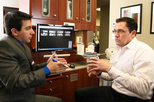 Dr. Daniel DiMatteo consults with patient at North Easton Dental Associates